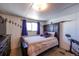 Stylish bedroom featuring a comfortable bed, TV, and unique decor, offering a modern and relaxing atmosphere at 6597 S State Highway 83, Franktown, CO 80116