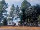Charming home with mature trees and inviting curb appeal, offering a peaceful and private setting at 6597 S State Highway 83, Franktown, CO 80116