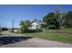 Charming single-story home with blue siding and mature trees surrounding the property at 6597 S State Highway 83, Franktown, CO 80116