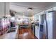 Bright kitchen with stainless steel appliances, ample counter space, and a cozy dining area for Gathering meals at 6597 S State Highway 83, Franktown, CO 80116