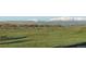 Picturesque land featuring rolling green hills, grazing cattle, and stunning mountain views in the distance at 6597 S State Highway 83, Franktown, CO 80116