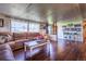 Comfortable living room featuring a large window, stylish decor, and plenty of space for relaxation and entertainment at 6597 S State Highway 83, Franktown, CO 80116