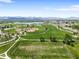 Expansive aerial view of a sports complex, featuring baseball fields and soccer fields, perfect for recreation and activities at 5674 S Ingalls St, Littleton, CO 80123