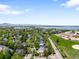 A high aerial shot of the neighborhood showcasing the lake and community at 5674 S Ingalls St, Littleton, CO 80123