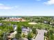 An aerial view of the home with a park, baseball field, and a large school in the background at 5674 S Ingalls St, Littleton, CO 80123