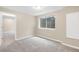 Basement room with carpeting and a window well at 5674 S Ingalls St, Littleton, CO 80123