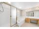Bathroom with large tub, shower, and vanity with a sink and counter space at 5674 S Ingalls St, Littleton, CO 80123