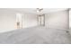 Spacious bedroom with neutral decor and multiple doorways at 5674 S Ingalls St, Littleton, CO 80123