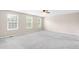 Spacious bedroom with three large windows allowing plenty of natural light at 5674 S Ingalls St, Littleton, CO 80123