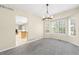 Bright dining room with a bay window and modern chandelier at 5674 S Ingalls St, Littleton, CO 80123