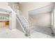 Elegant entryway with a staircase leading to the upper level and newly installed carpet at 5674 S Ingalls St, Littleton, CO 80123