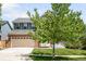 Charming two-story brick home with a well-manicured lawn and a spacious two car garage at 5674 S Ingalls St, Littleton, CO 80123