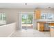 Spacious kitchen with tile flooring, backyard views and wood cabinets at 5674 S Ingalls St, Littleton, CO 80123