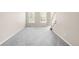 Bright living room with new gray carpet and natural light at 5674 S Ingalls St, Littleton, CO 80123
