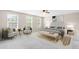Serene main bedroom with a king-sized bed, sitting area, and natural light at 5674 S Ingalls St, Littleton, CO 80123