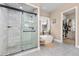 Modern bathroom with a glass-enclosed shower, soaking tub, and stylish fixtures at 5489 Country Club Dr, Larkspur, CO 80118