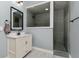 Modern bathroom featuring a stylish vanity and shower with contemporary tile work at 5489 Country Club Dr, Larkspur, CO 80118