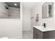 Modern bathroom with sleek vanity, tiled shower, and contemporary finishes at 5489 Country Club Dr, Larkspur, CO 80118