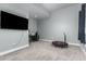 Versatile game room with gray walls, a desk, and a mini trampoline for fitness and fun at 5489 Country Club Dr, Larkspur, CO 80118