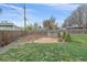 Backyard featuring a custom stone patio and privacy fence, ideal for relaxing and entertaining at 6482 S Cedar St, Littleton, CO 80120