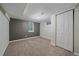 Finished basement bedroom with carpeted floors and a large window at 6482 S Cedar St, Littleton, CO 80120