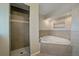 Bright bathroom with a corner soaking tub and a separate tiled shower at 6482 S Cedar St, Littleton, CO 80120
