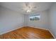 Simple bedroom with hardwood floors, a ceiling fan, and natural light from the window at 6482 S Cedar St, Littleton, CO 80120