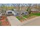 Charming single-story home with a well-maintained front yard and detached garage at 6482 S Cedar St, Littleton, CO 80120