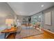Inviting living room with hardwood floors, a large window, and neutral decor at 6482 S Cedar St, Littleton, CO 80120