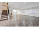 Spacious finished basement with wood-look flooring, perfect for entertaining and relaxing at 179 N Prairie Falcon Pkwy, Brighton, CO 80601