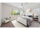 A modern bedroom with large windows and an abundance of natural light at 179 N Prairie Falcon Pkwy, Brighton, CO 80601