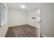 Bright bedroom with window, neutral walls, and modern flooring for a comfortable and stylish space at 179 N Prairie Falcon Pkwy, Brighton, CO 80601