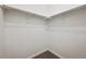 Walk-in closet with carpeted floor, white walls, and a hanging rod at 179 N Prairie Falcon Pkwy, Brighton, CO 80601