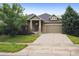 Charming single-Gathering home with a well-maintained lawn and a two-car garage at 179 N Prairie Falcon Pkwy, Brighton, CO 80601