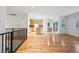 Spacious open floorplan with hardwood floors connecting kitchen and living area at 179 N Prairie Falcon Pkwy, Brighton, CO 80601