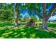 Park common area featuring picnic table, grill, and mature shade trees at 3161 Madison Ave # R313, Boulder, CO 80303