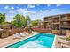 Inviting community pool surrounded by lounge chairs and well-maintained landscaping at 3161 Madison Ave # R313, Boulder, CO 80303