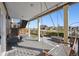 Covered back deck has composite floors and a porch swing at 18340 W 85Th Dr, Arvada, CO 80007