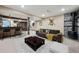 Spacious finished basement with a full bar, entertainment area, and comfortable seating at 18340 W 85Th Dr, Arvada, CO 80007