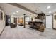 Finished basement with bar, seating, and entertainment area at 18340 W 85Th Dr, Arvada, CO 80007