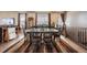 Formal dining room featuring ample seating, natural light from the windows, and decorative accents at 18340 W 85Th Dr, Arvada, CO 80007