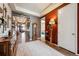 Inviting entryway featuring hardwood floors, decorative accents, an area rug and a neutral color palette at 18340 W 85Th Dr, Arvada, CO 80007