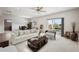 Bright living room with a large window, comfortable seating, and access to the backyard at 18340 W 85Th Dr, Arvada, CO 80007