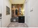 Functional mud room with custom storage and decor elements with a tiled floor for easy maintenance at 18340 W 85Th Dr, Arvada, CO 80007