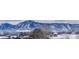 Snow covered mountain view and rooftops in winter at 2938 Kalmia Ave # 6, Boulder, CO 80301