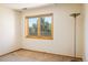 Bedroom featuring neutral carpeting and a large window with scenic views at 2938 Kalmia Ave # 6, Boulder, CO 80301