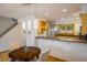Cozy dining area with modern lighting, adjoining an open kitchen with stainless steel appliances and natural light at 2938 Kalmia Ave # 6, Boulder, CO 80301