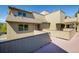 Tan siding townhome featuring a patio and mature trees at 2938 Kalmia Ave # 6, Boulder, CO 80301
