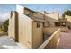 Tan colored building exterior with walkway and railing at 2938 Kalmia Ave # 6, Boulder, CO 80301