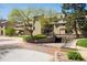 Community exterior with mature trees, landscaping and parking garage at 2938 Kalmia Ave # 6, Boulder, CO 80301